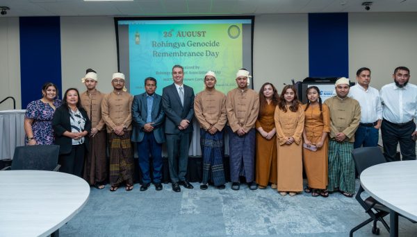 Members of the Rohingya community pose with MATC President Anthony Cruz during Rohingya Genocide Remembrance Day.