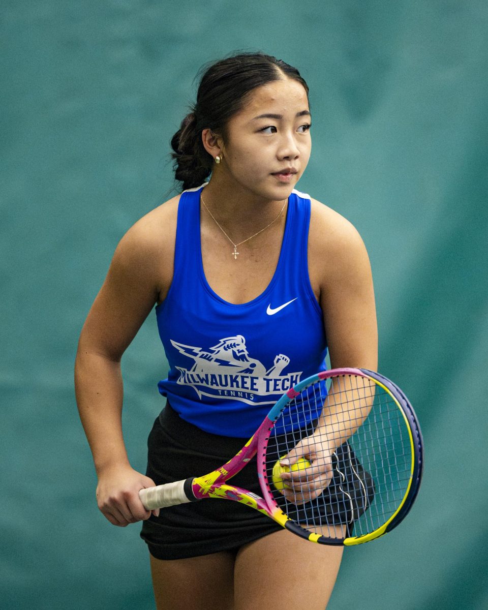 Freshman Reese Thao prepares to deliver a serve in doubles against Waubonsee Community college on September 20, 2025.