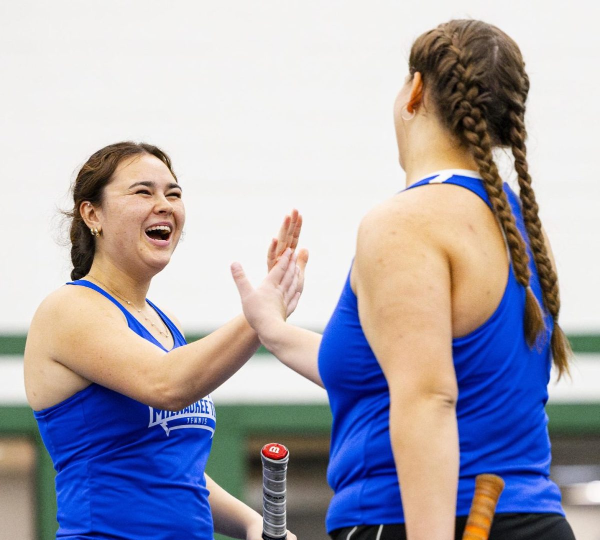 Freshman Alexandra Suchanek (l) and Sophomore Aisha Kaabachi (r) celebrate after a successful rally for a point in doubles against Waubonsee Community College on September 20, 2025.