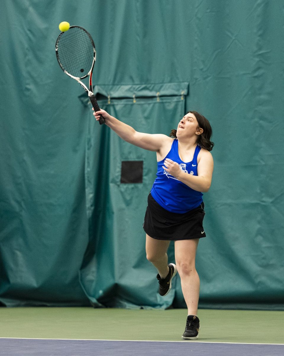Freshman Natalie Schroeder delivers a serve to Waubonsee Community College in doubles on September 20, 2025.