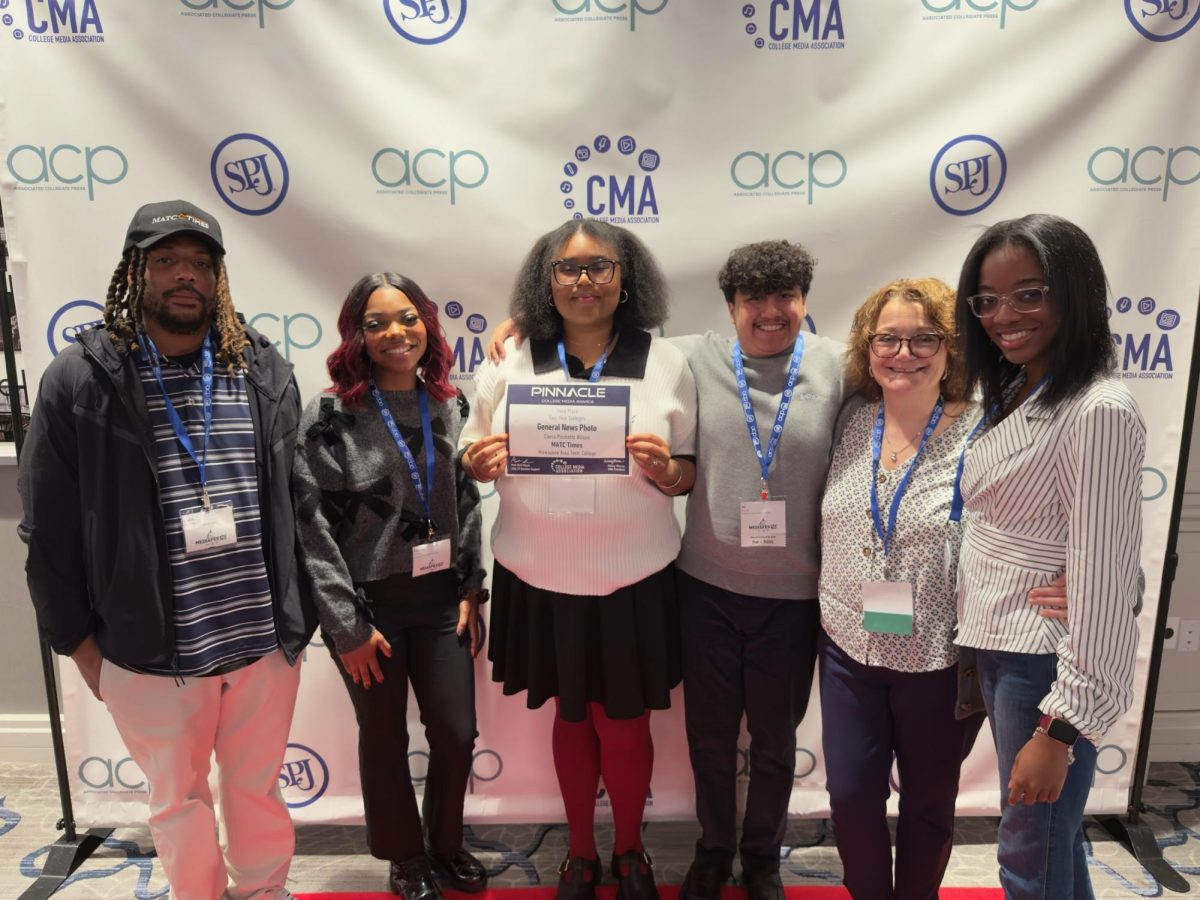 (from left to right): Times Business Manager Faith Jenkins, Editor-in-Chief Zanaia Joshua, Photography Editor Cierra P. Wilson, Sports Photography Editor Juan Carlos Wood, Times Advisor Barb Volbrecht, and Sports Editor Crystal Williams pose at MediaFest25 with Wilson's "Pinnacle Award" for Third Place in the General News Photo category in the national competition. (Photo taken by a conference attendee.)