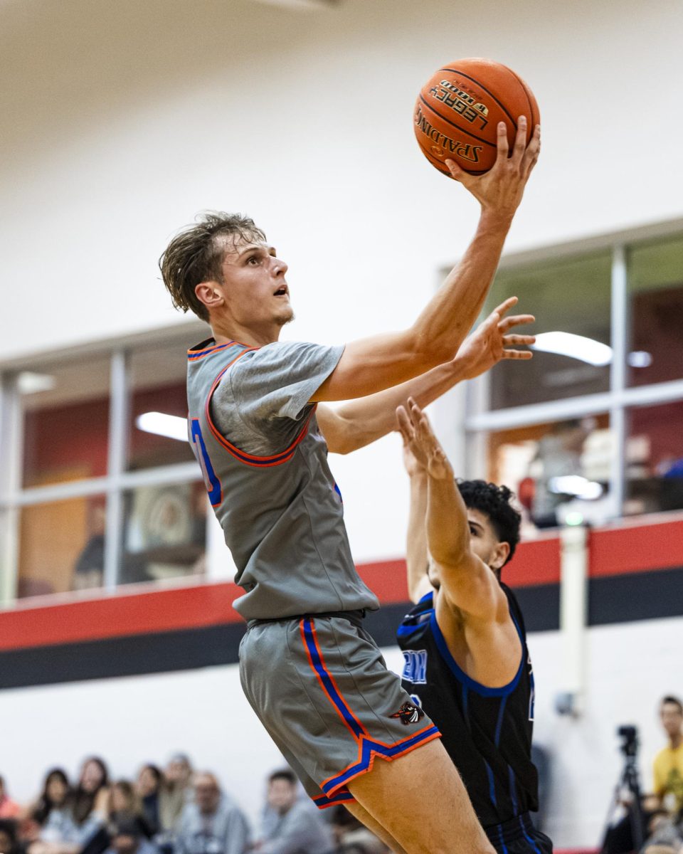 Sophomore guard Jayden Hackett goes in for a layup in the home opener win (131-76) against Elgin Community College on November 13, 2025. 