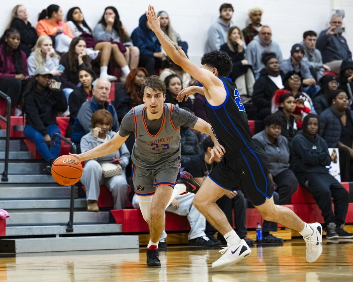 Stormers sophomore Noah Daniels looks to attack inside the ark against his defender in the home opener win, 131-76, against Elgin Community College on November 13, 2025. 