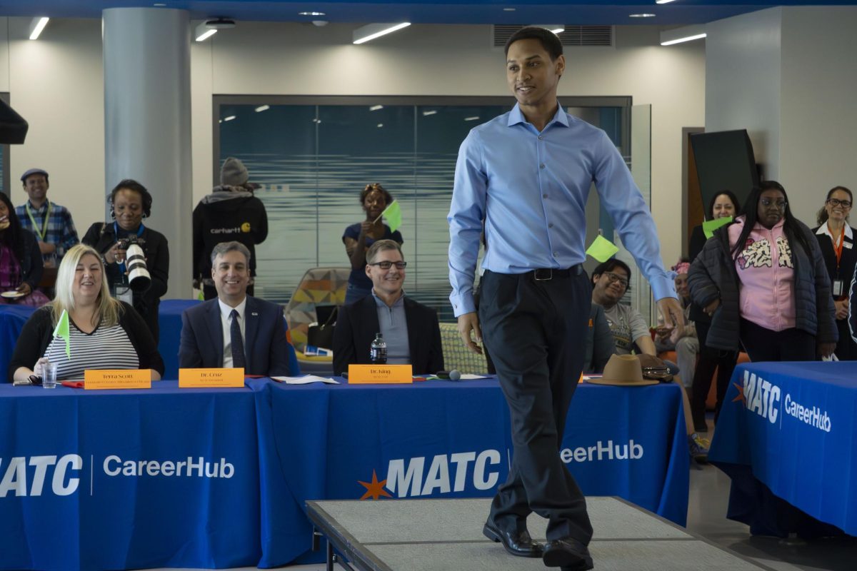 A model receives high marks for their interview wardrobe during the MATC CareerHub Fashion Show on February 18. The panel of judges in the background includes MATC President Anthony Cruz and Executive Vice President and Provost Phillip King (right). 