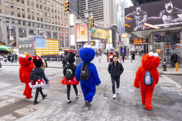 Street performers report for duty in Times Square. March 6, 2026.