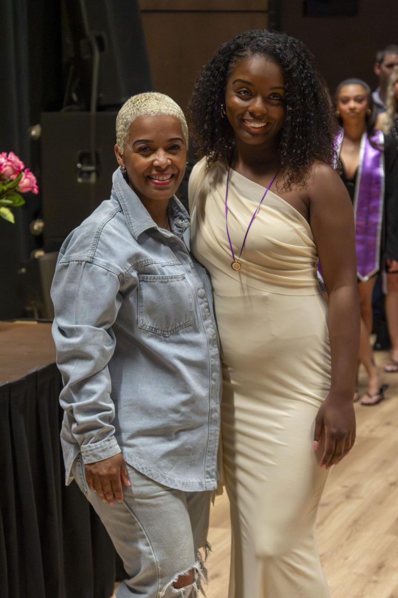 Dental Hygiene program graduate poses with family member