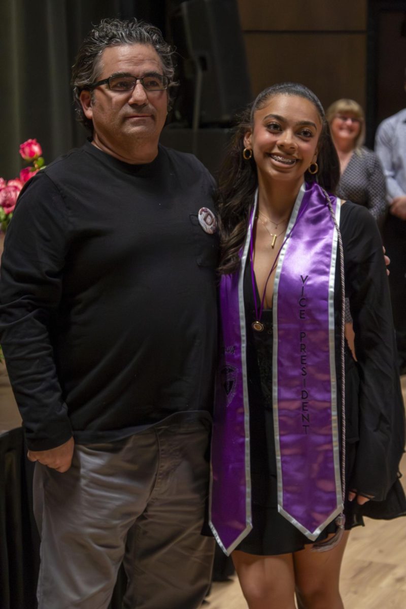 Dental Hygiene program graduate poses with family member