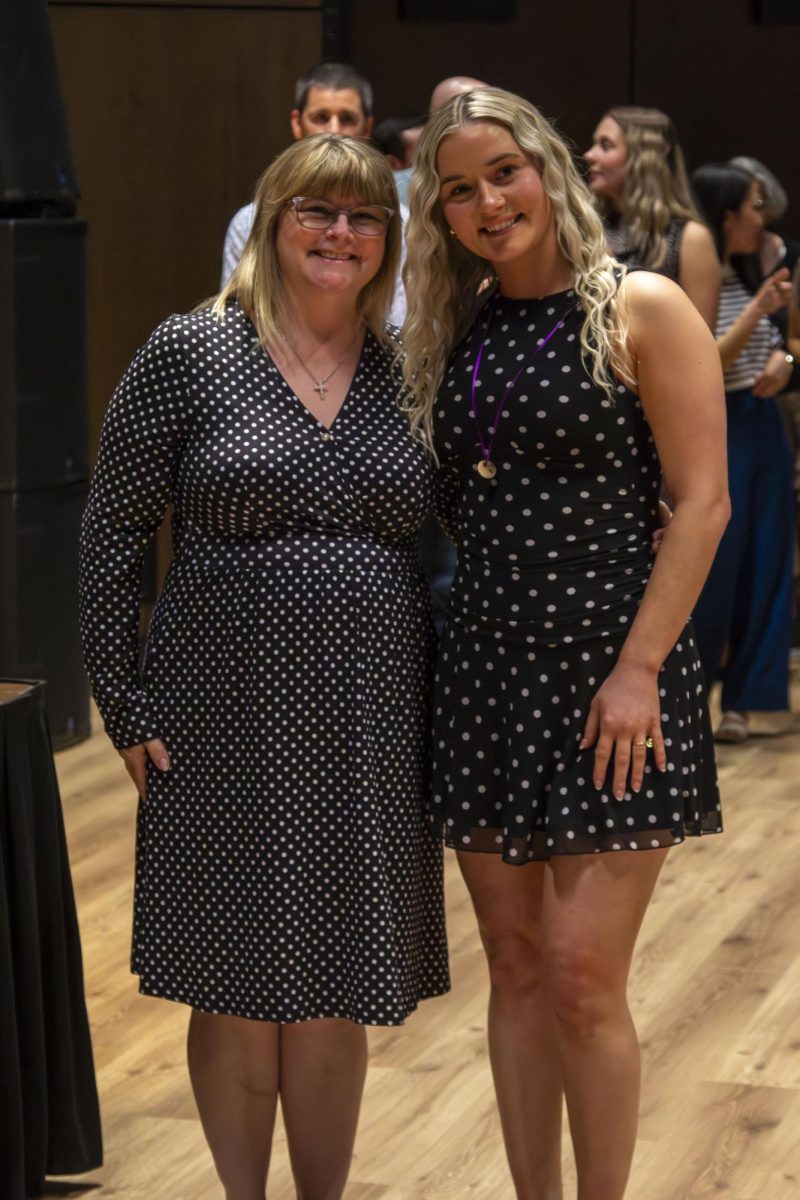 Dental Hygiene program graduate poses with family member