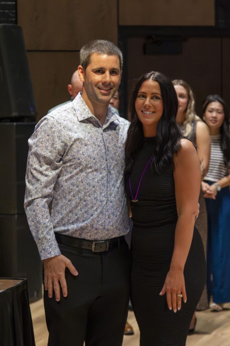 Dental Hygiene program graduate poses with family member