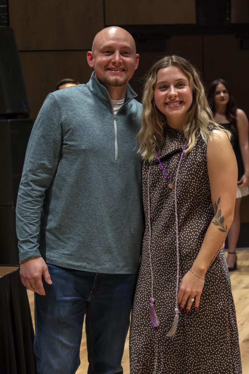 Dental Hygiene program graduate poses with family member
