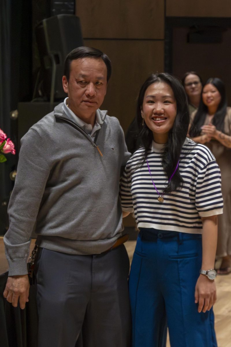 Dental Hygiene program graduate poses with family member