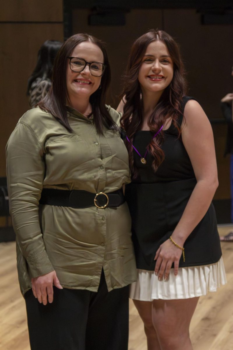 Dental Hygiene program graduate poses with family member