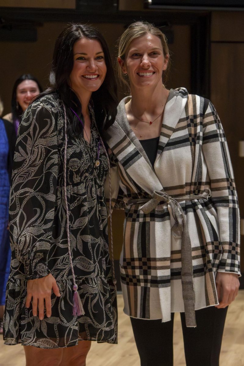 Dental Hygiene program graduate poses with family member
