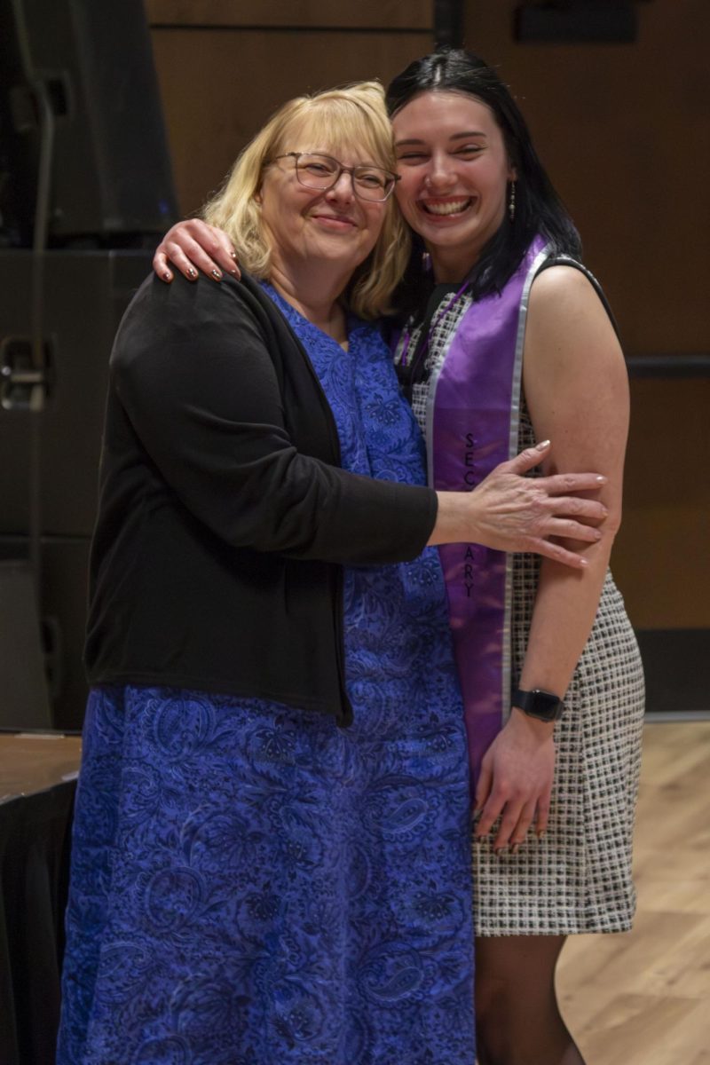 Dental Hygiene program graduate poses with family member