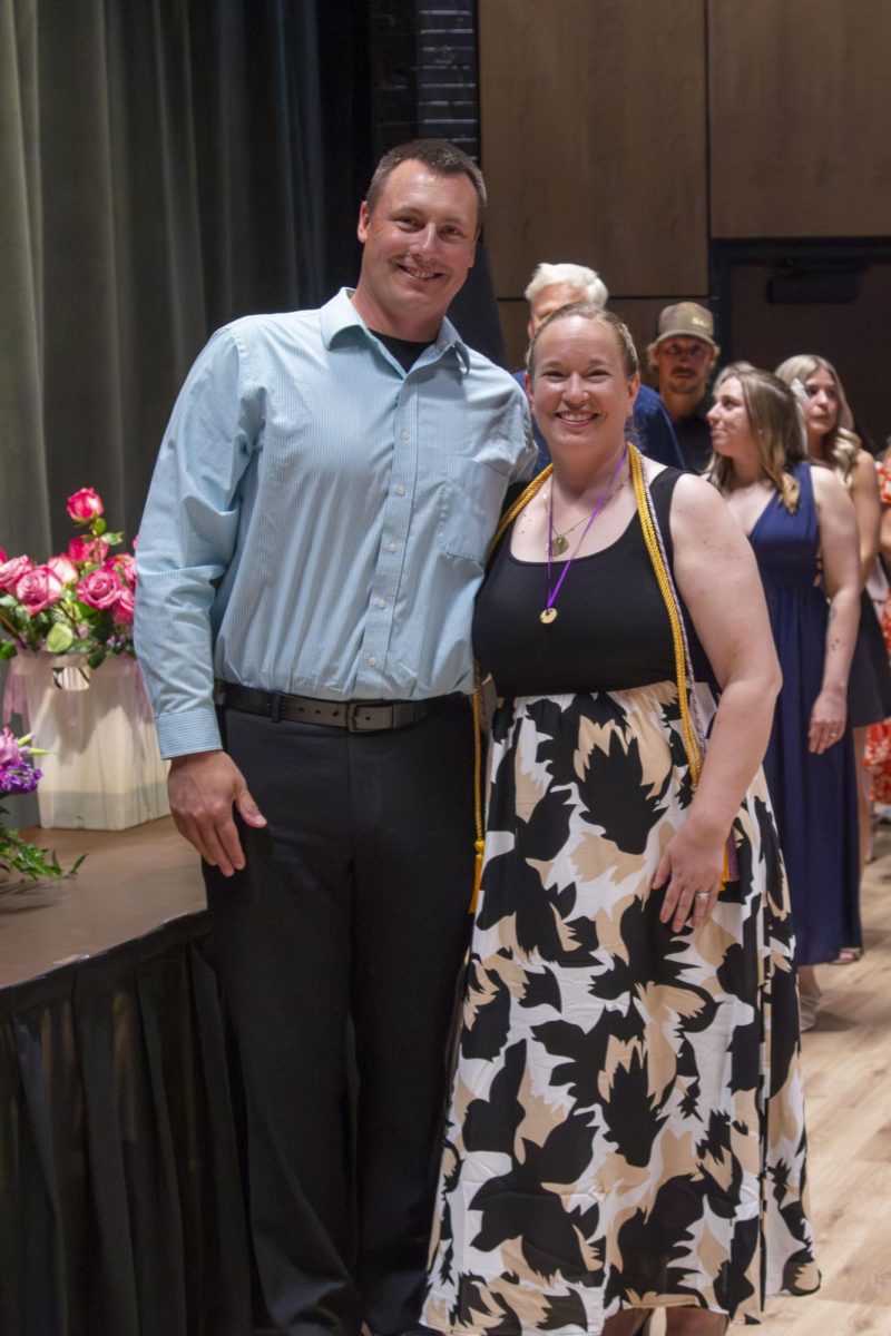 Dental Hygiene program graduate poses with family member