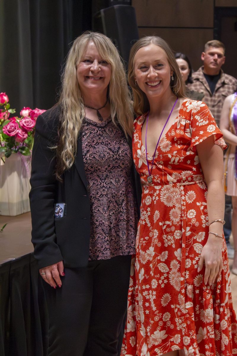 Dental Hygiene program graduate poses with family member