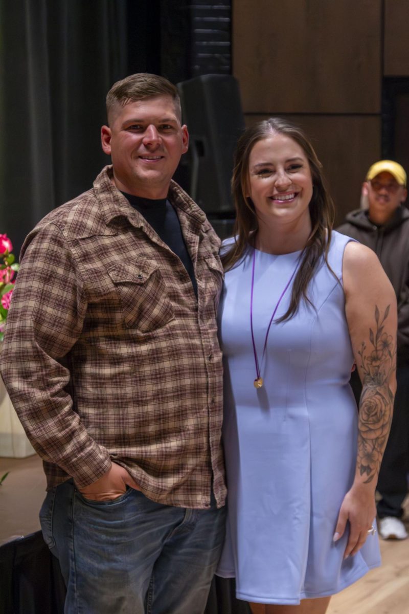 Dental Hygiene program graduate poses with family member