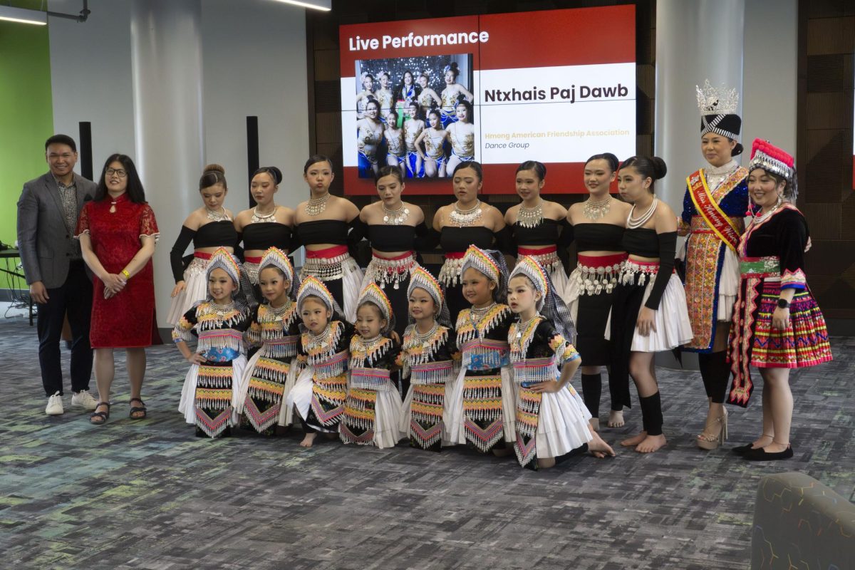 Participants of the Flavors, Fabrics, and Facts event pose for a photo, May 6, 2026
