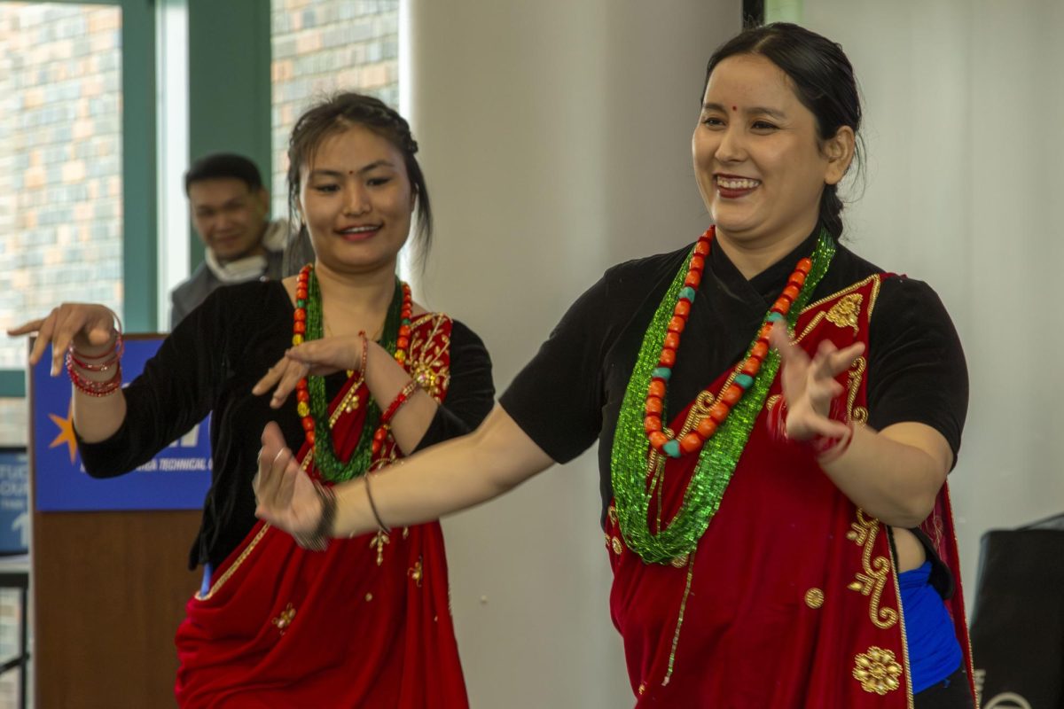 Dancers demonstrate a customary dance routine.