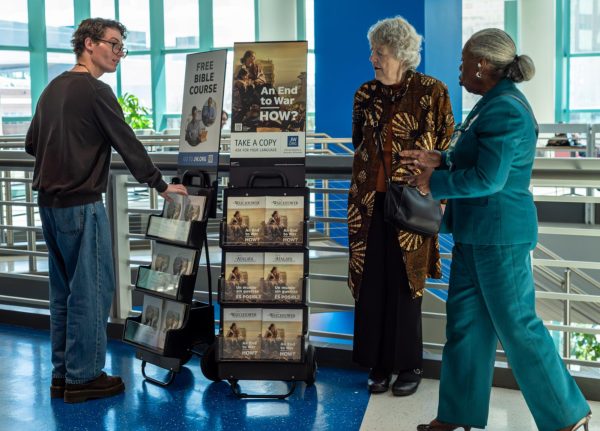 Connor Servais, MATC Times Managing Editor, engages with two Jehovah’s Witnesses on the 3rd floor of MATC’s S Building.