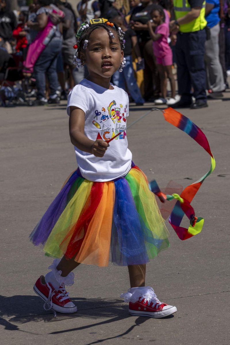 Juneteenth Jubilee Parade participant waves her ribbon 