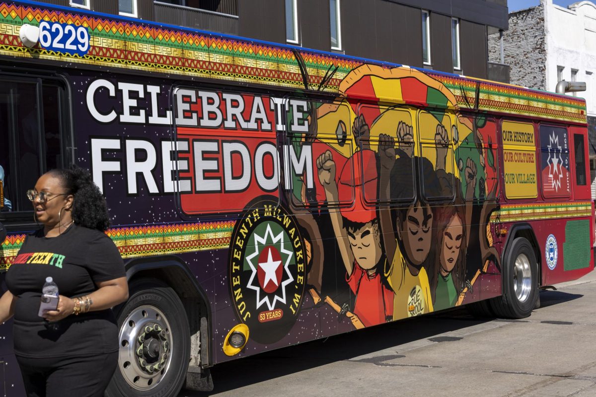 Milwaukee County Transit System Juneteenth bus drives along the parade route 