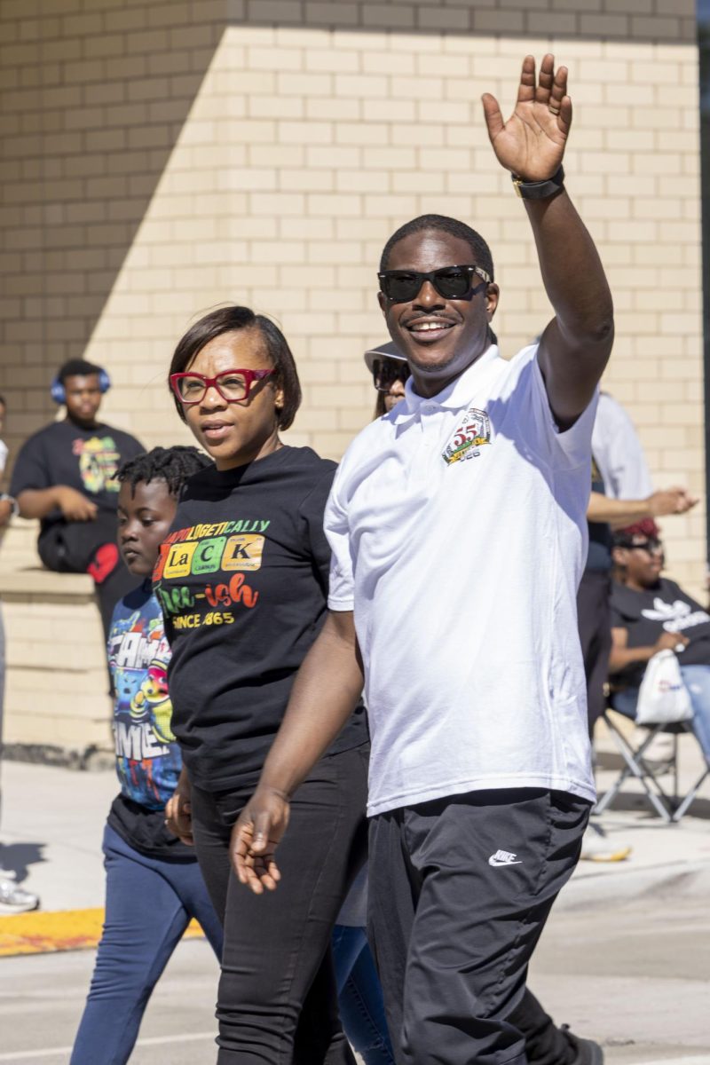 Milwaukee County Executive David Crowley marches with his wife 