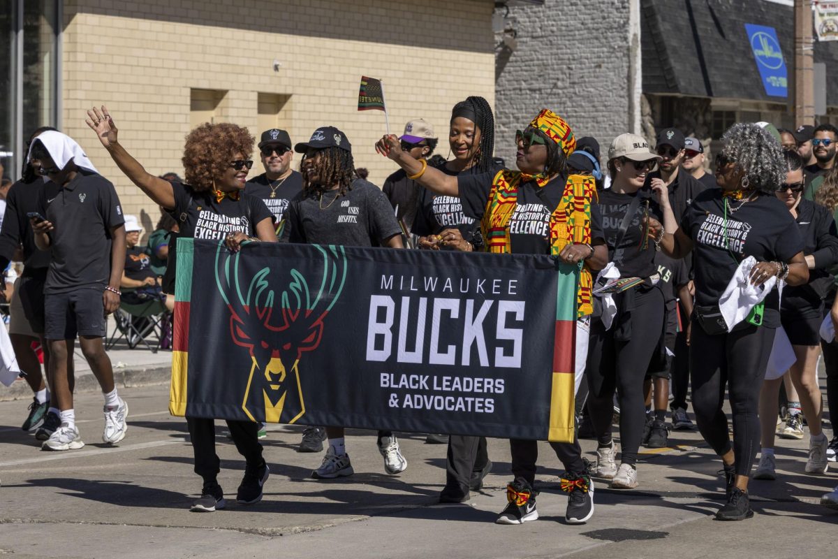 Milwaukee Bucks staffers engage with the crowd 