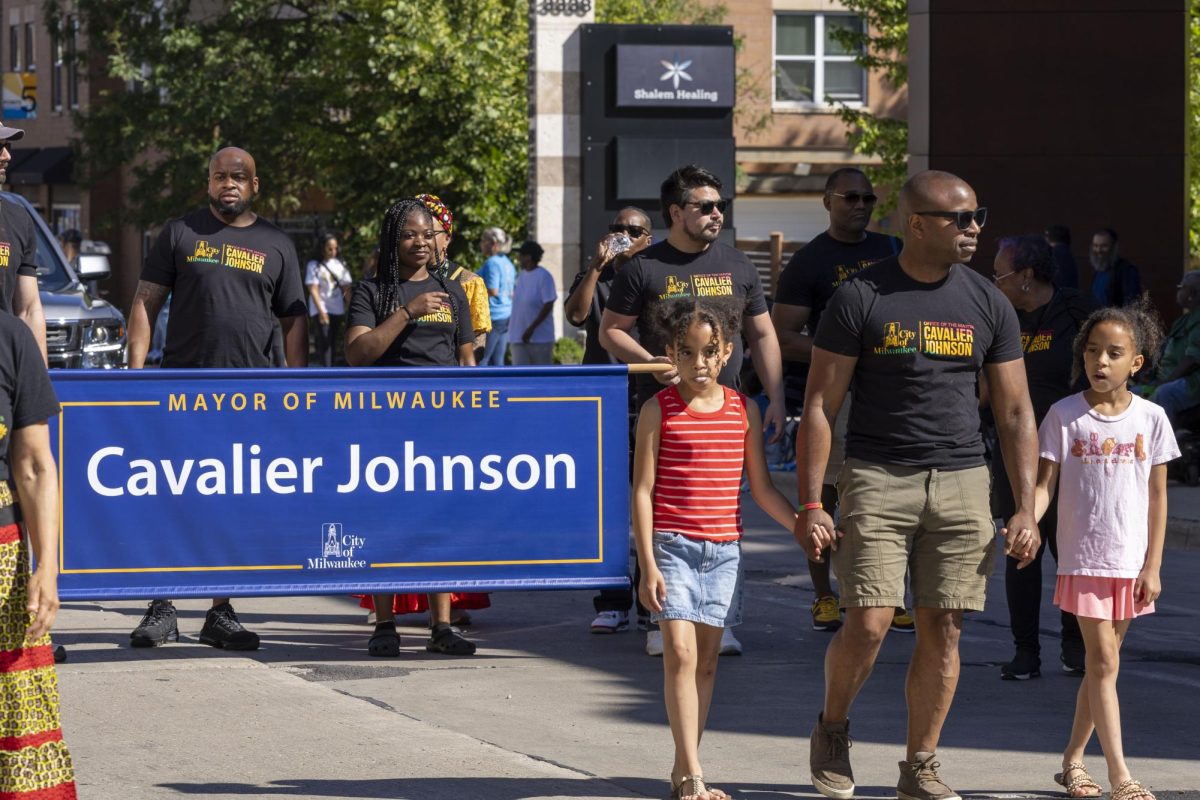 Mayor Cavalier Johnson marches with his daughters in the 2026 Juneteenth Jubilee Parade 