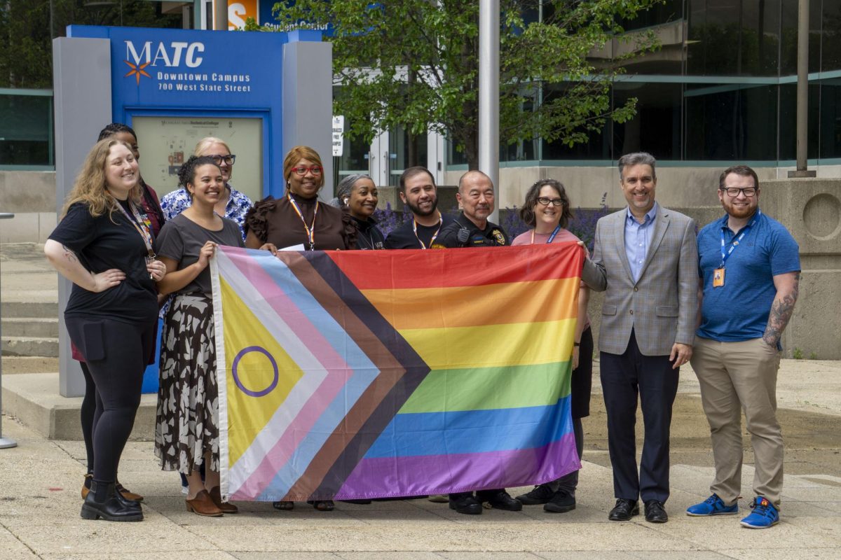 MATC administrators participate in a pride flag raising ceremony at the Downtown Campus