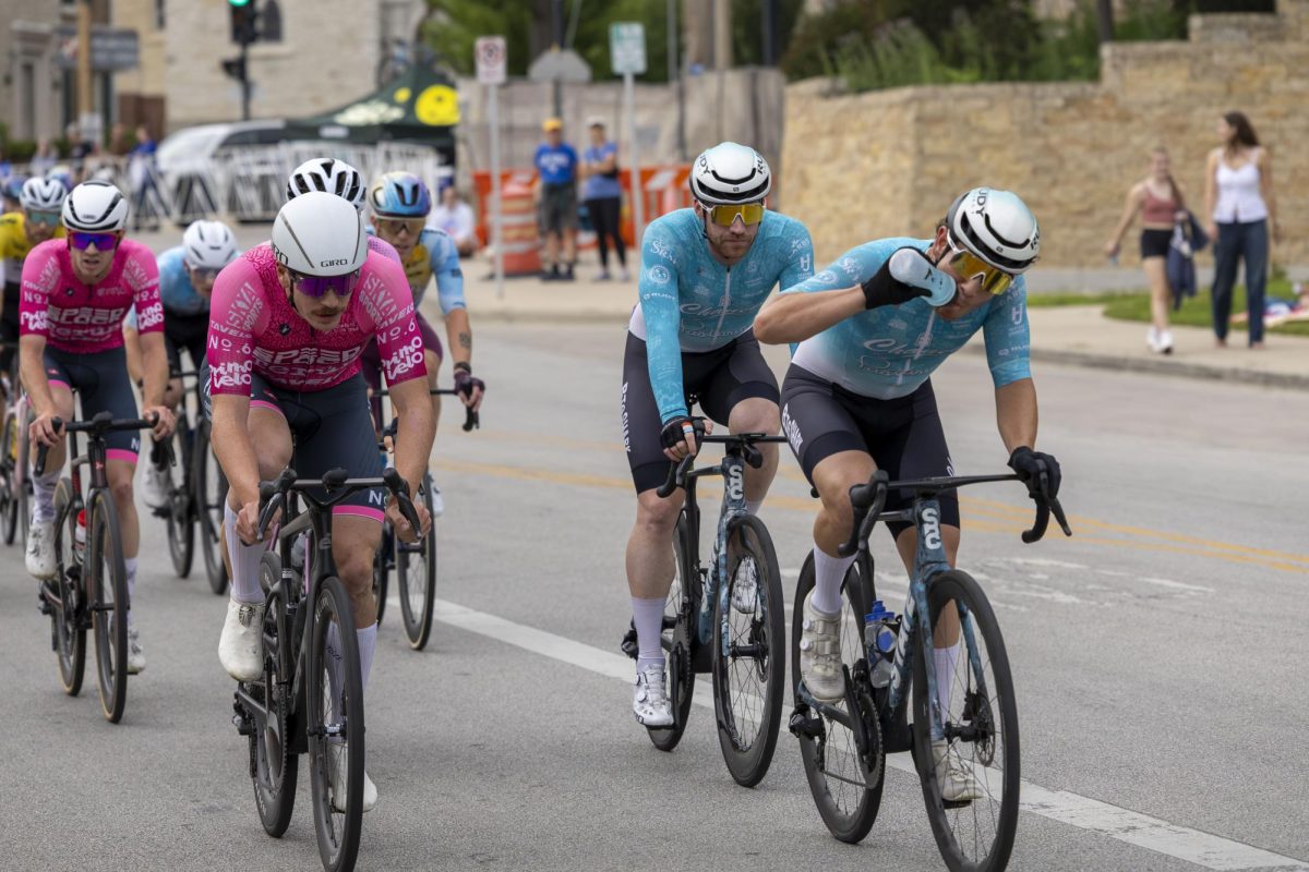 Cyclist hydrates while keeping pace with the pack