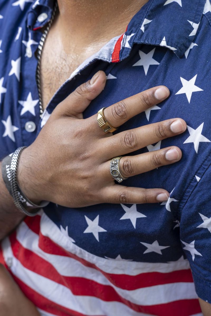 USA fan places hand over his heart during the National Anthem 
