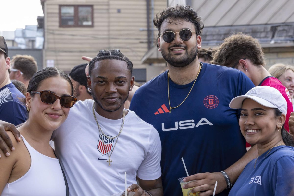 USA fans pose for a photo at the Nomad World Pub World Cup viewing party 
